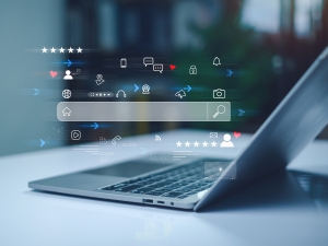 Organic Traffic Is Down – Is Your B2B Marketing Failing? Computer with floating SEO icons